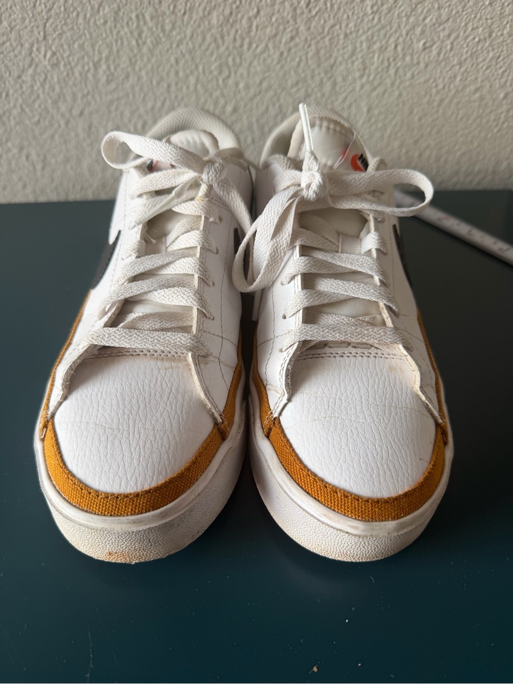 Nike Women’s White Sneakers with Mustard Accent